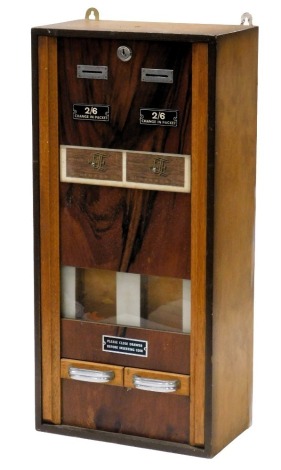 A mid century wooden cigar dispenser, for Wills Whiffs Cigars, packs of three, with plaques stated 2/6 change in packet, 64cm high, 30cm wide, 18cm deep.