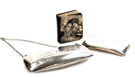 A George V silver purse, with engine turned decoration, circular reserve monogram engraved, with chain suspension, Birmingham 1919, together with a calling card case top, Birmingham 1909, 3.40oz all in, and a book of common prayer, with silver cover to fr