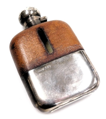 A George VI cut glass, silver and leather mounted hip flask, Sheffield 1940, 13cm high.