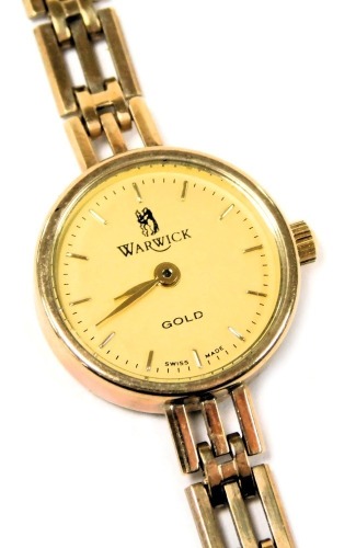 A Warwick lady's 9ct gold cased wristwatch, circular champagne dial, on a three bar bracelet strap, 12.1g all in.