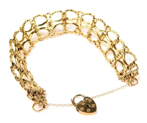 A 9ct gold fancy link bracelet, on a heart shaped padlock clasp, with safety chain as fitted, 8.5g.