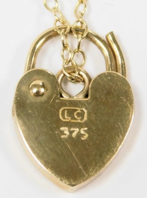 A 9ct gold fancy link bracelet, on a heart shaped padlock clasp, with safety chain as fitted, 8.5g. - 2