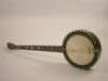 W. Dennis. A rosewood and mother-of-pearl inlaid banjo