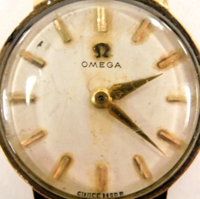 An Omega lady's 9ct gold cased wristwatch, the circular white dial with batons, on a brick link bracelet, boxed, 19.7g all in. - 2