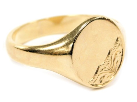 A 9ct gold gentleman's signet ring, with partial foliate engraving, size Z, 6.4g.