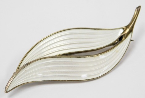 An Aksel Holmsen silver and white enamel brooch, of double leaf form, impressed marks.