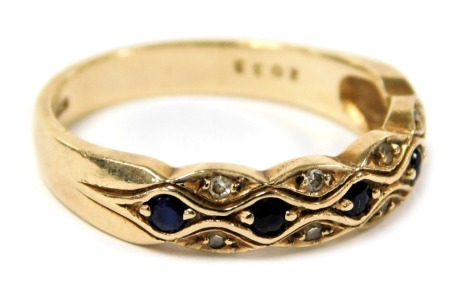 A 9ct gold sapphire and diamond dress ring, set with five sapphires, with pairs of diamonds at intervals, size N, 2.5g.