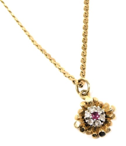 A 9ct gold ruby and diamond floral pendant, on a S link neck chain, with bolt ring clasp, 2.9g.