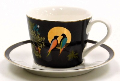 A Portmeirion porcelain breakfast cup and saucer, designed by Sara Miller, decorated with birds, on a brown ground, printed marks, boxed. - 2