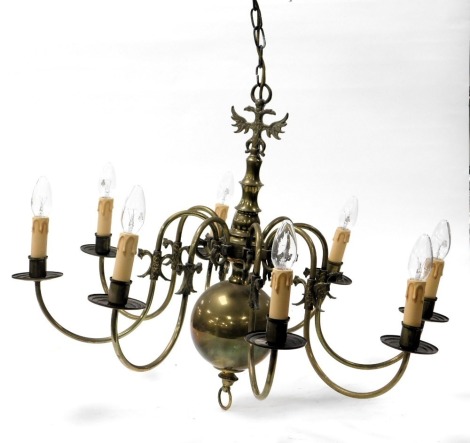 A 17thC style brass eight branch chandelier, 60cm high, with hanging chain and ceiling mount.