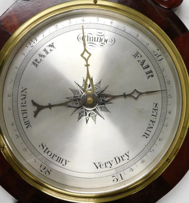 A Victorian mahogany wheel barometer, with thermometer, the case with foliate carved decoration, 92cm high. - 2