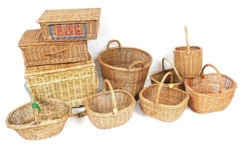 A group of wicker baskets, a linen basket and hampers. (under 1 table)