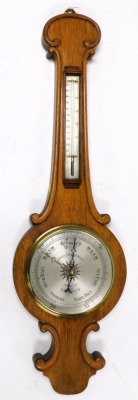 A Victorian oak cased wheel barometer, by Wood, late Abraham and Company, 20 Lord St, Liverpool, with silvered dial, and thermometer, 93cm high.