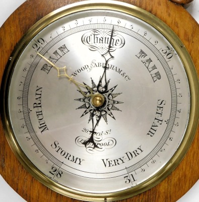 A Victorian oak cased wheel barometer, by Wood, late Abraham and Company, 20 Lord St, Liverpool, with silvered dial, and thermometer, 93cm high. - 2