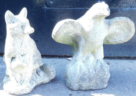 A concrete garden figure of a bird of prey, with its wings out stretched, 42cm wide, and a further sculpture of a fox and cub, 45cm high. (2)