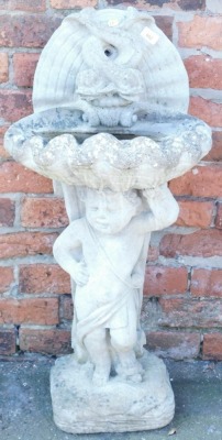 A concrete birdbath, of shell form, with an entwined dolphin back, raised on a figure of a putti, above a square cushion base, 95cm high.