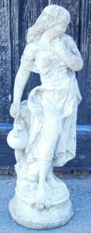 A concrete garden sculpture, of female water carrier, raised on a circular base, 67cm high.