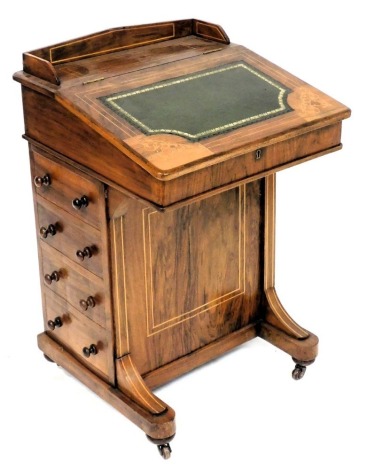 A Victorian walnut and inlaid davenport, the gilt tooled leather slope opening to reveal an interior with three drawers, above four drawers and four dummy drawers, raised on a plinth base, on castors, 76cm high, 53cm wide, 53cm deep.