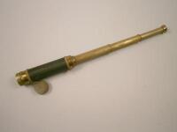 A brass four draw telescope, with lens cap and woven hand piece, unnamed, 18cm long.