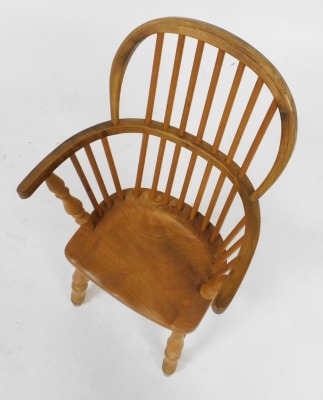 A beech and elm child's Windsor chair, raised on turned legs united a H framed stretcher, 40cm wide. - 2