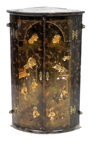 A 19thC Japanned lacquer bow front hanging corner cupboard, the doors decorated with pagodas and other figures in a landscape, opening to reveal two shelves, 93cm high, 58cm wide, 39cm deep.