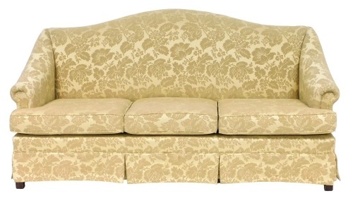 A Parker Knoll three seater hump back sofa, upholstered in gold floral damask fabric, raised on square legs, 182cm wide.