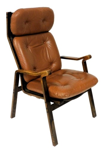 A mid century Scandinavian bentwood armchair, with button tan leather headrest and cushions, 64cm wide.