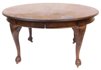 A Victorian mahogany extending dining table, with two leaves, the oval moulded top raised on four ball and claw feet, with two leaves, 74cm high, 146cm wide, 156cm extended, 117cm deep.