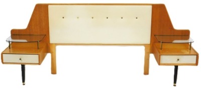 A mid century G-Plan bedroom suite, designed by E Gomme, comprising, a dressing table with a triptych mirror above one long drawer, over two pedestals each with two drawers, raised on brass capped turned legs, 135cm high, 124cm wide, 47cm deep, a double h - 4