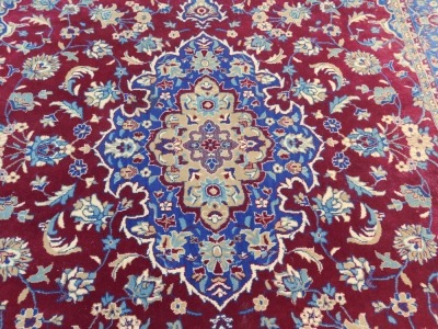 An Ikea Vedak Egyptian red ground rug, with a central floral medallion, on a field of flowers, within repeating floral borders, 200cm x 300cm. - 2