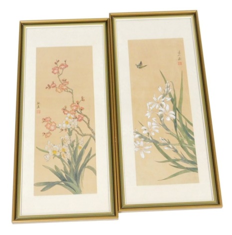 A pair of Japanese watercolours of prunus blossom and narcissus, lilies, on silk, both signed, 59cm x 24cm. (2)