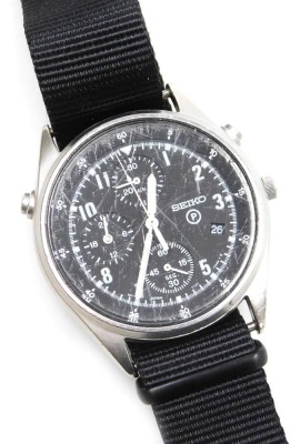 A Seiko British military chronograph watch, in stainless steel case with black dial, three subsidiary hands and date, with luminous Arabic numerals and hands, the case back numbered 6645-99 8149181 with broad arrow above 0134/96, serial number 5D4554, and