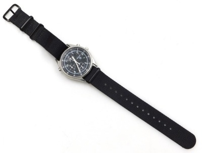 A Seiko British military chronograph watch, in stainless steel case with black dial, three subsidiary hands and date, with luminous Arabic numerals and hands, the case back numbered 6645-99 8149181 with broad arrow above 0134/96, serial number 5D4554, and - 2