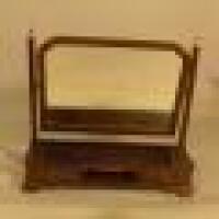 An Edwardian mahogany swing framed dressing table mirror