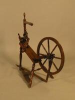 A Victorian turned fruitwood spinning wheel