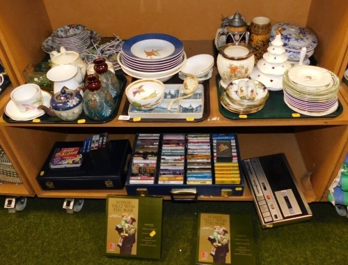 General household effects, to include a pair of Leaders pottery vases, 16cm high, bachelor's teapot, part dinner wares, collector's plates, flagons, Royal Worcester Evesham pattern bowl, blue and white transfer printed tureen and cover (AF). (2 shelves)