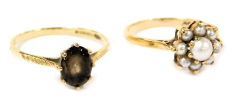 A 9ct gold and seed pearl ring, in a flower head setting, size M, together with a 9ct gold and smoky quartz ring, size N, 2.8g.