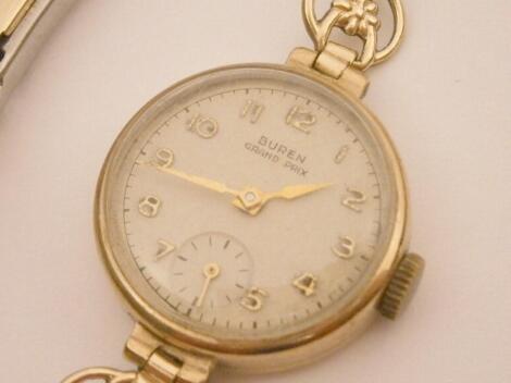 A Buren Swiss made ladies wristwatch with yellow metal strap.