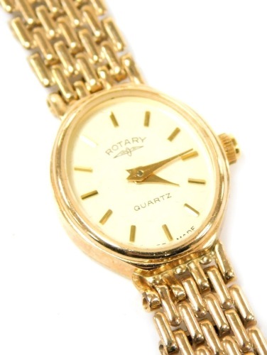 A Rotary lady's 9ct rose gold cased wristwatch, oval champagne dial, quartz movement, on a bracelet strap, 15.3g all in.