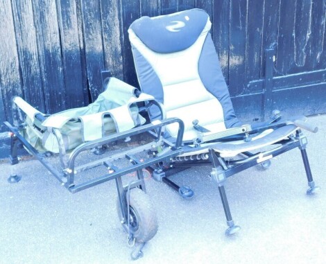 A folding fishing barrow and a Korum folding fishing chair.