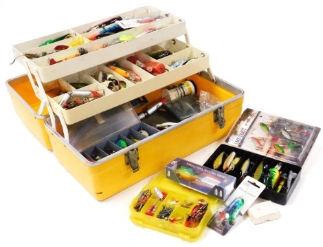 A large collection of Predator fishing lures, including jointed pike plugs, poppers, spinners, etc., all contained in a cantilever box.