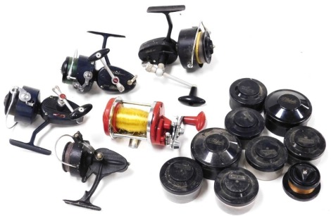 Three Mitchell fixed spool fishing reels, including a model 307, model 411, and another, an Intrepid fixed spool reel and a multiplier by Morris Limited, and several Mitchell spare spools, with cases.