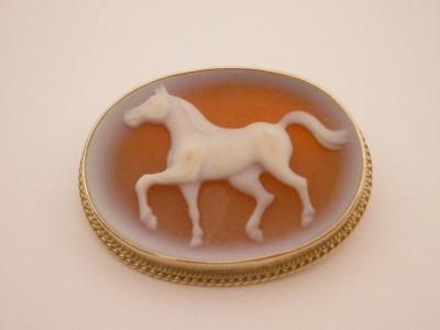 A glass intaglio in the form of a horse