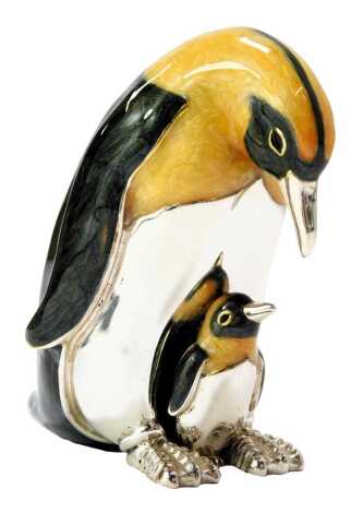 A silver and enamel figure group modelled as a penguin and chick, stamped 925, 5cm high.