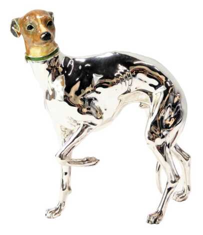 A Saturno silver and enamel figure modelled as a Greyhound, with one paw raised, wearing green collar, stamped Saturno Italy 925, 15cm high. (AF)