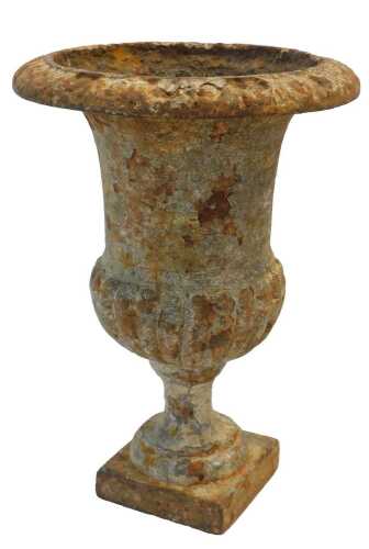 A 19thC cast iron urn, of semi-fluted form, raised on a square base, 22cm high.