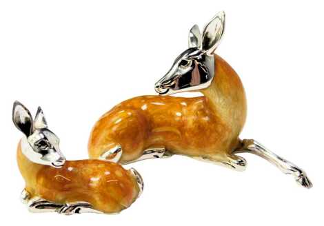 Two silver and enamel figures, modelled as a recumbent deer, stamped 925, 4.5cm high, and a fawn, 2.5cm high.