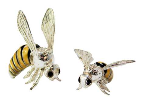 Two silver and enamel figures modelled as bees, stamped Italy 925, 3.5cm high and 1.5cm high.