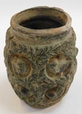 An early 20thC Continental pottery vase, relief decorated with birds in niches, and repeating leaves, 15cm high. (AF) - 2