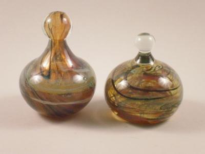 Two Mdina mottle glass door stops or paperweights